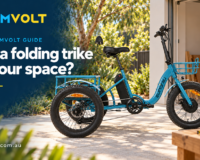 ZoomVolt guide banner with a blue EUNORAU electric trike beside a garage and tape measure, headed Will a folding trike fit your space?